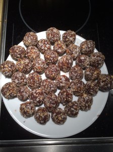A double batch of Paleo dark chocolate truffles rolled in shredded coconut and pecans.