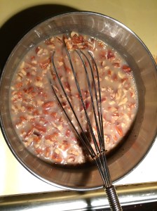 Add the pecans to the second mixture after it has reduced and slightly thickened.